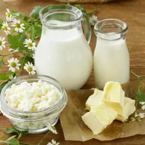 Milk, cheese and butter on a wooden table