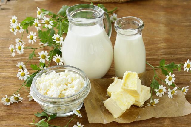 Milk, cheese and butter on a wooden table